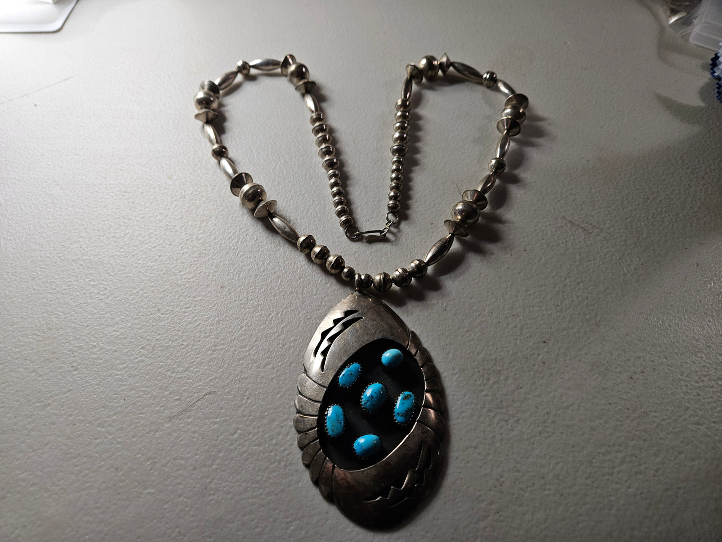 Zuni Tribe Native American Sterling Silver Jewelry with Large Pendant with Turquoise Inlay